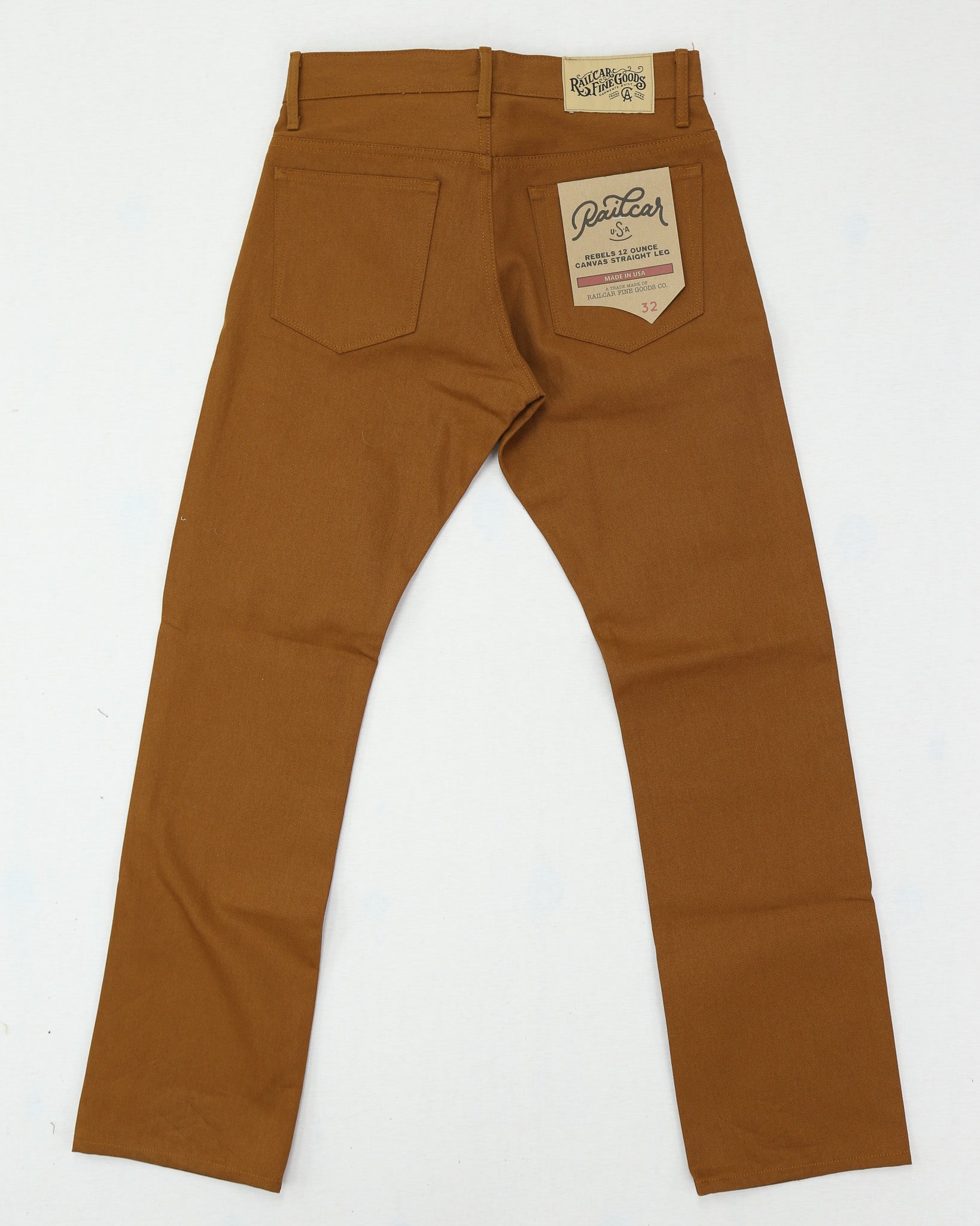 Brown canvas pants with a brand label on a white background