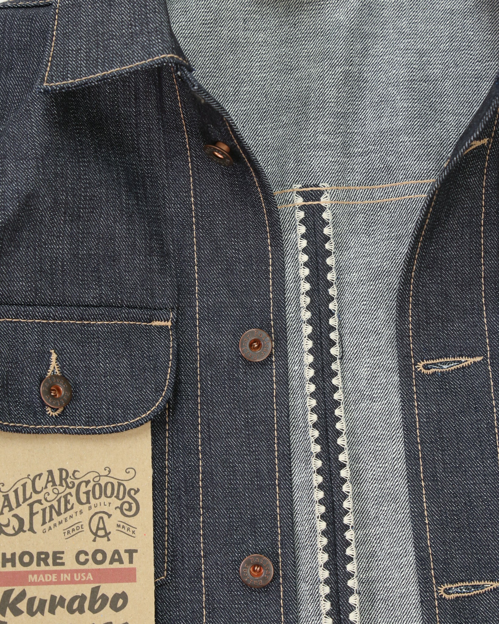 Close-up of a denim jacket with a visible brand label.