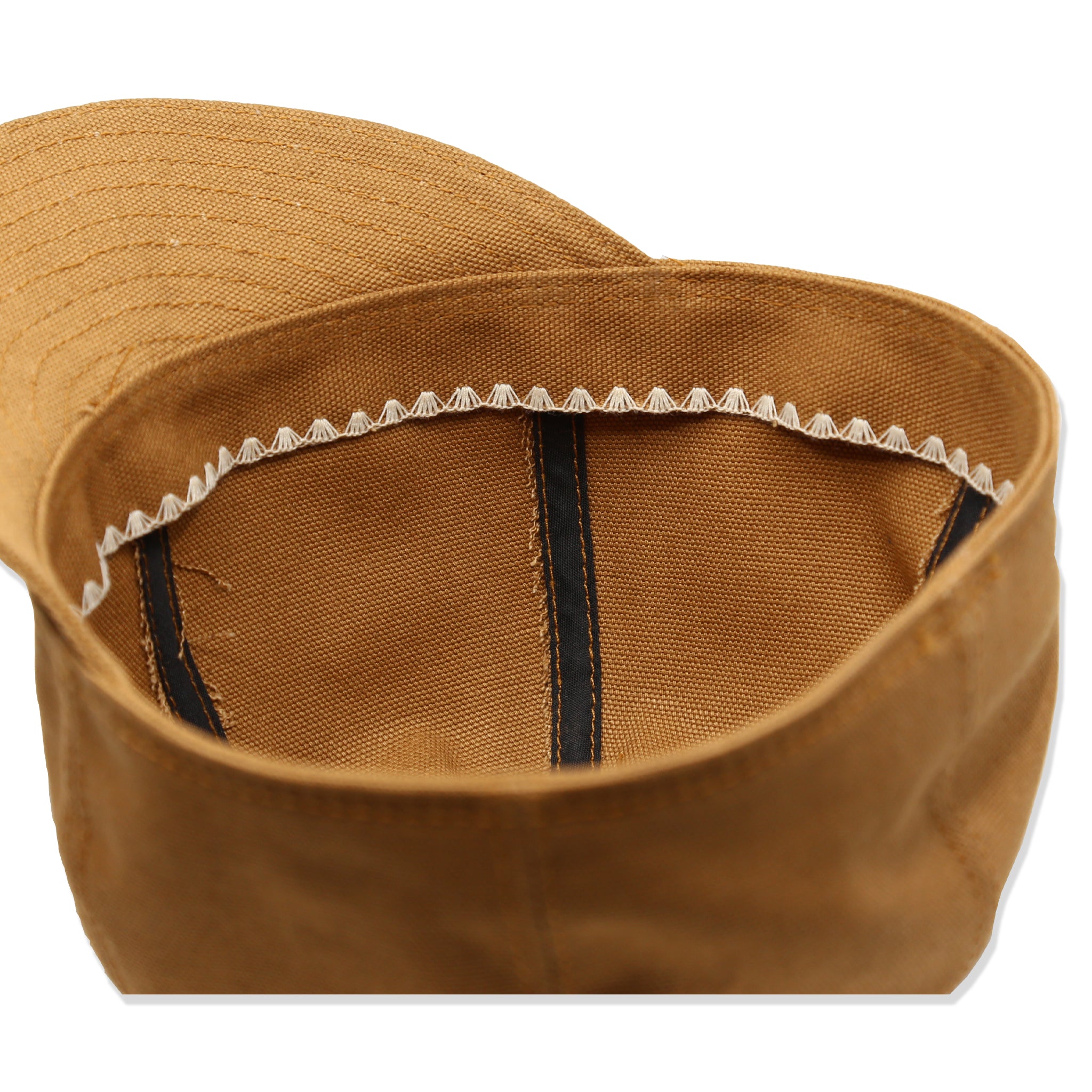 Interior Detail of A brown mechanic hat made from duck canvas, with a sweat band and a flat brim.