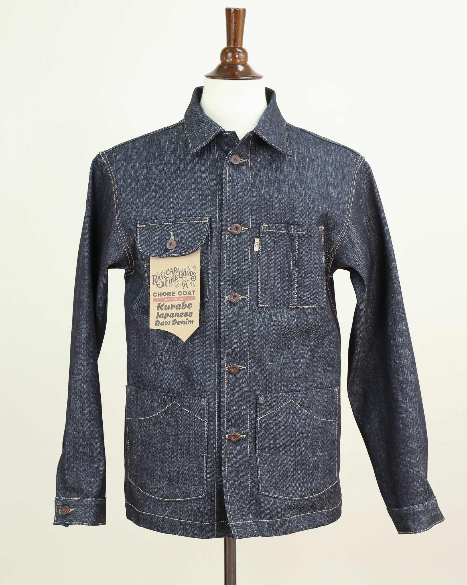 Denim jacket on a mannequin against a white background