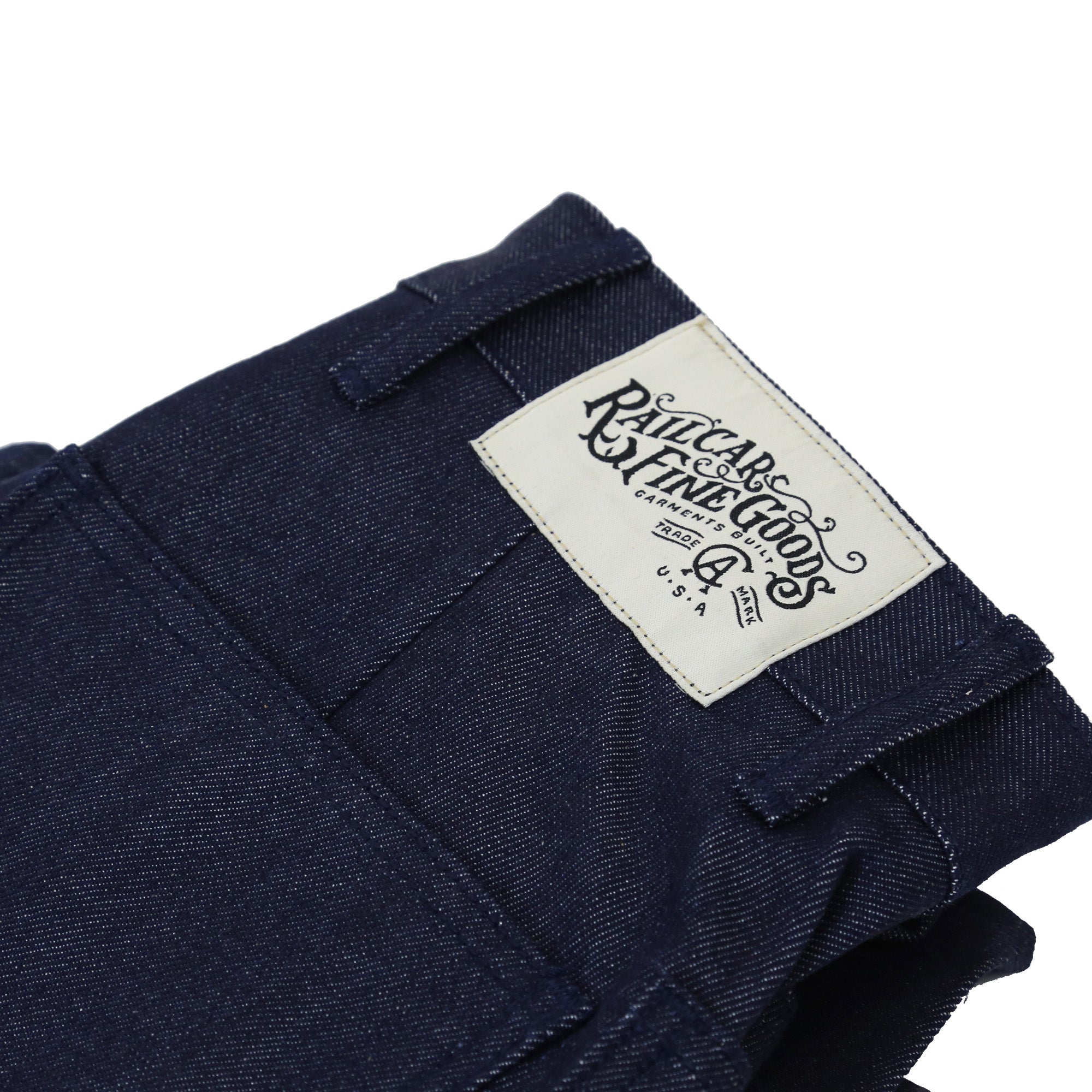 Folded Pair of Mariner Unisex Men's Full Leg 12.75 Oz Classic Indigo showing cloth patch detail