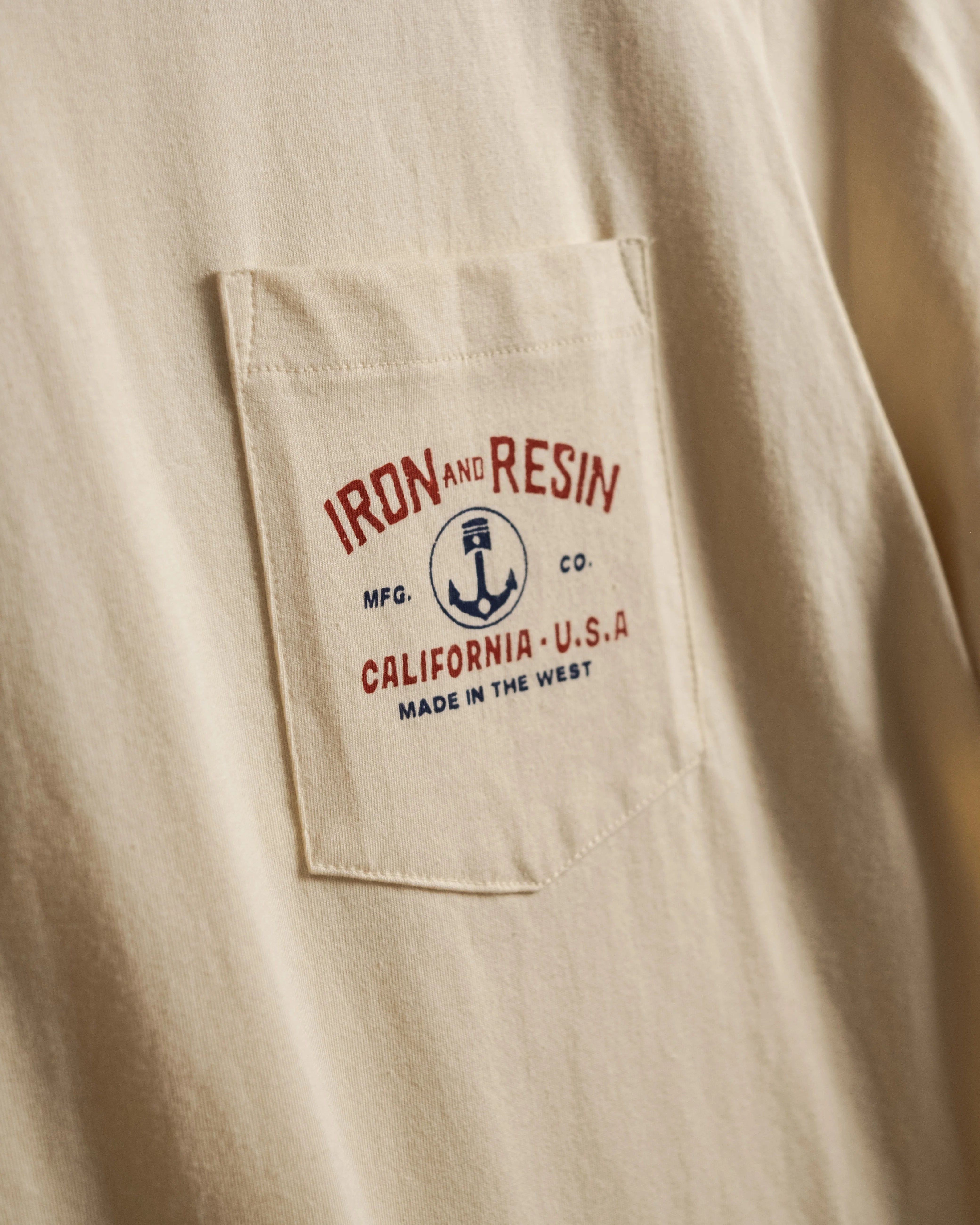 Close Up of Front Pocket of Iron & Resin Men's Shop Bench Tee - Natural 