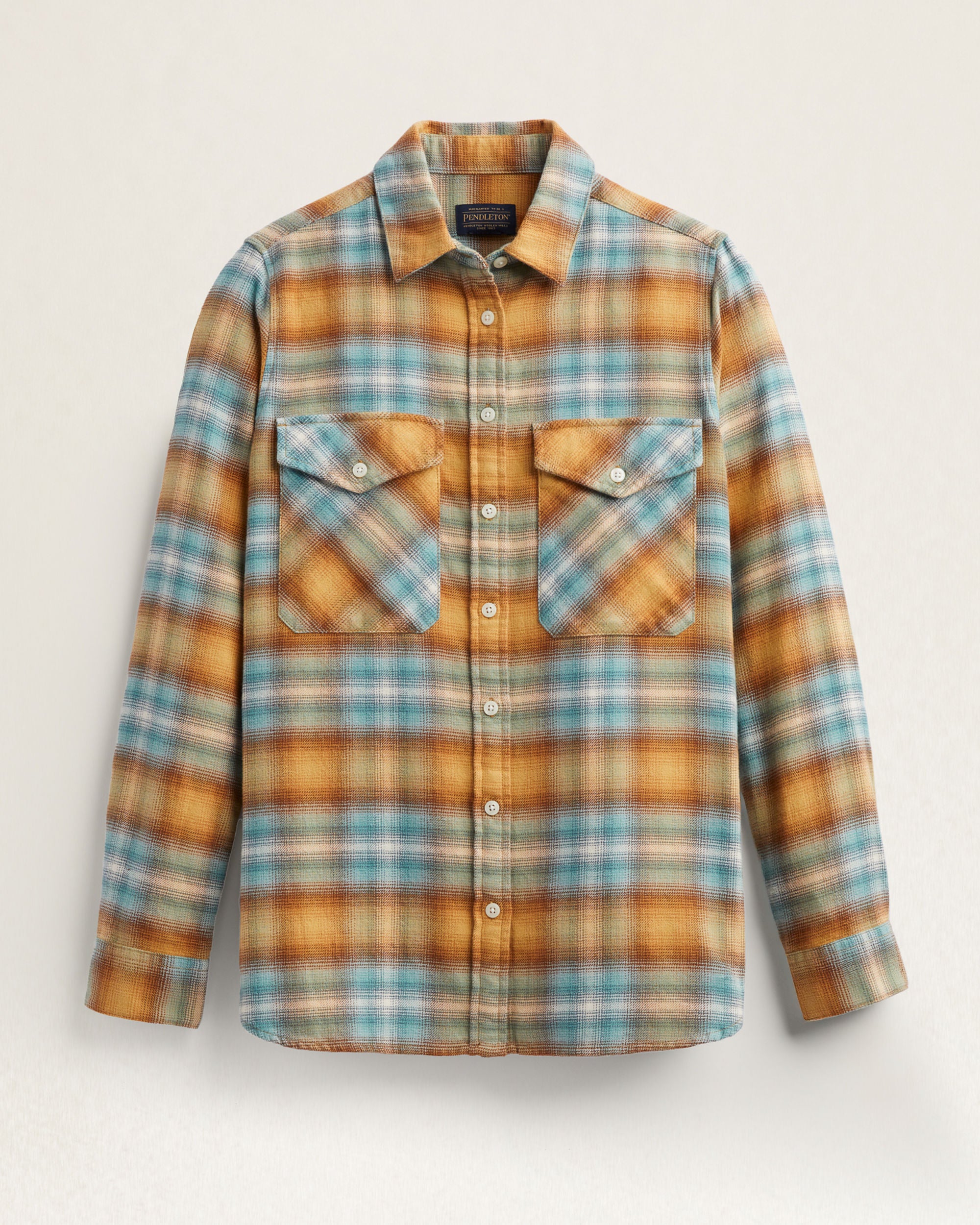 Plaid shirt with brown, blue, and beige colors on a light gray background