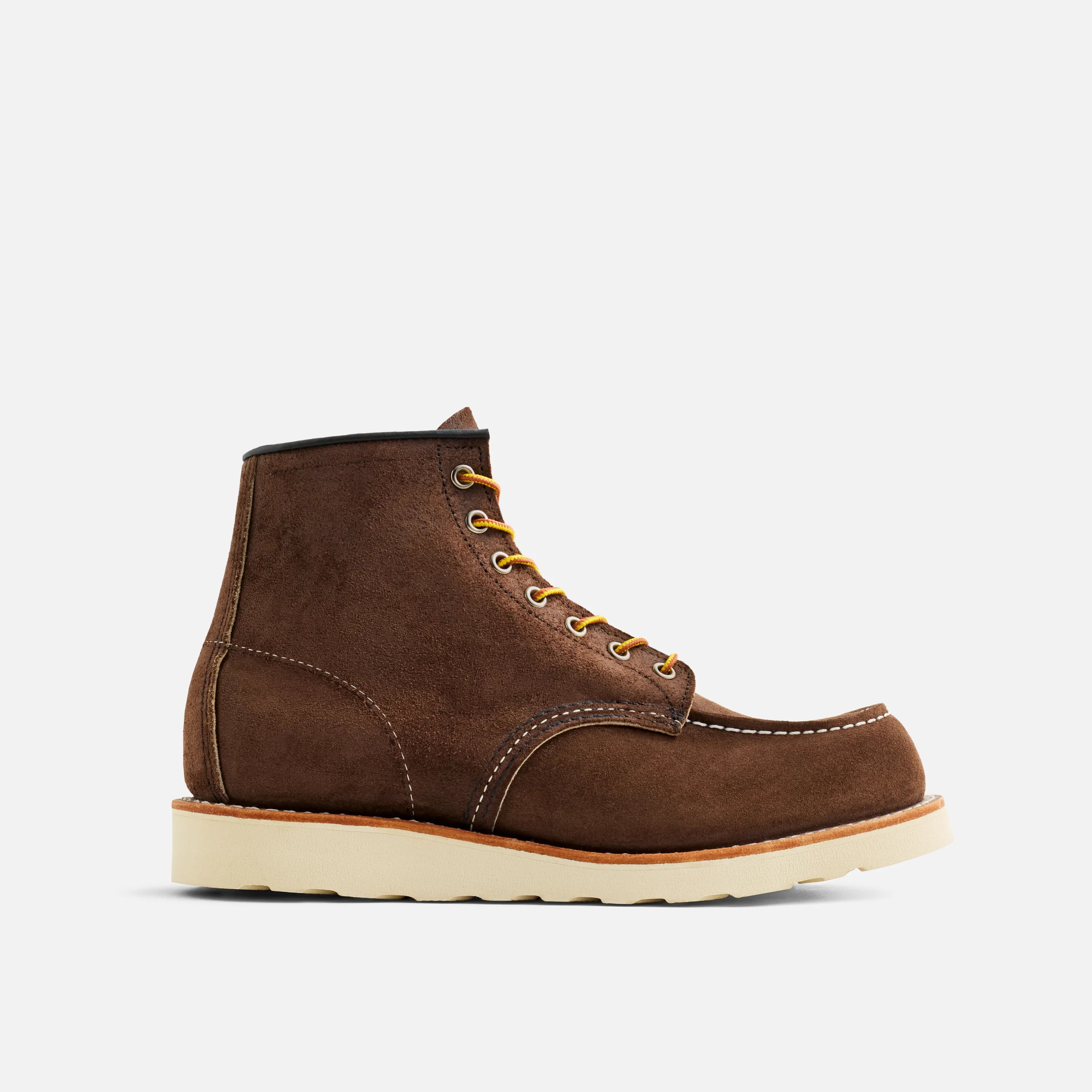 Brown leather boot with yellow laces on a white background