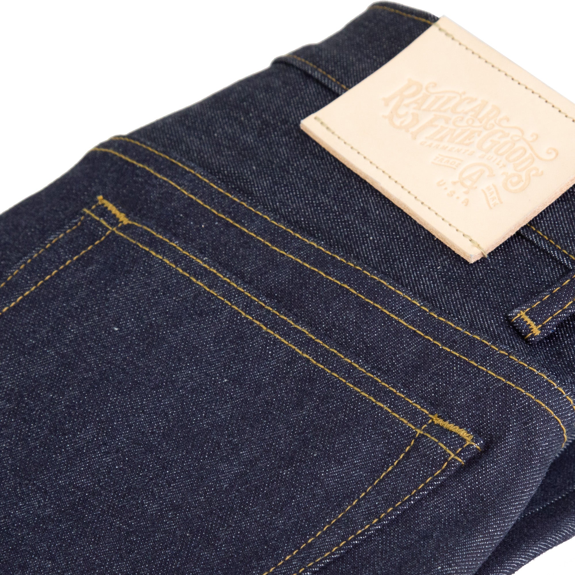 Back Pocket and Leather Detail of Spikes X110 Taper Leg 13.5 Oz Classic Indigo Selvedge