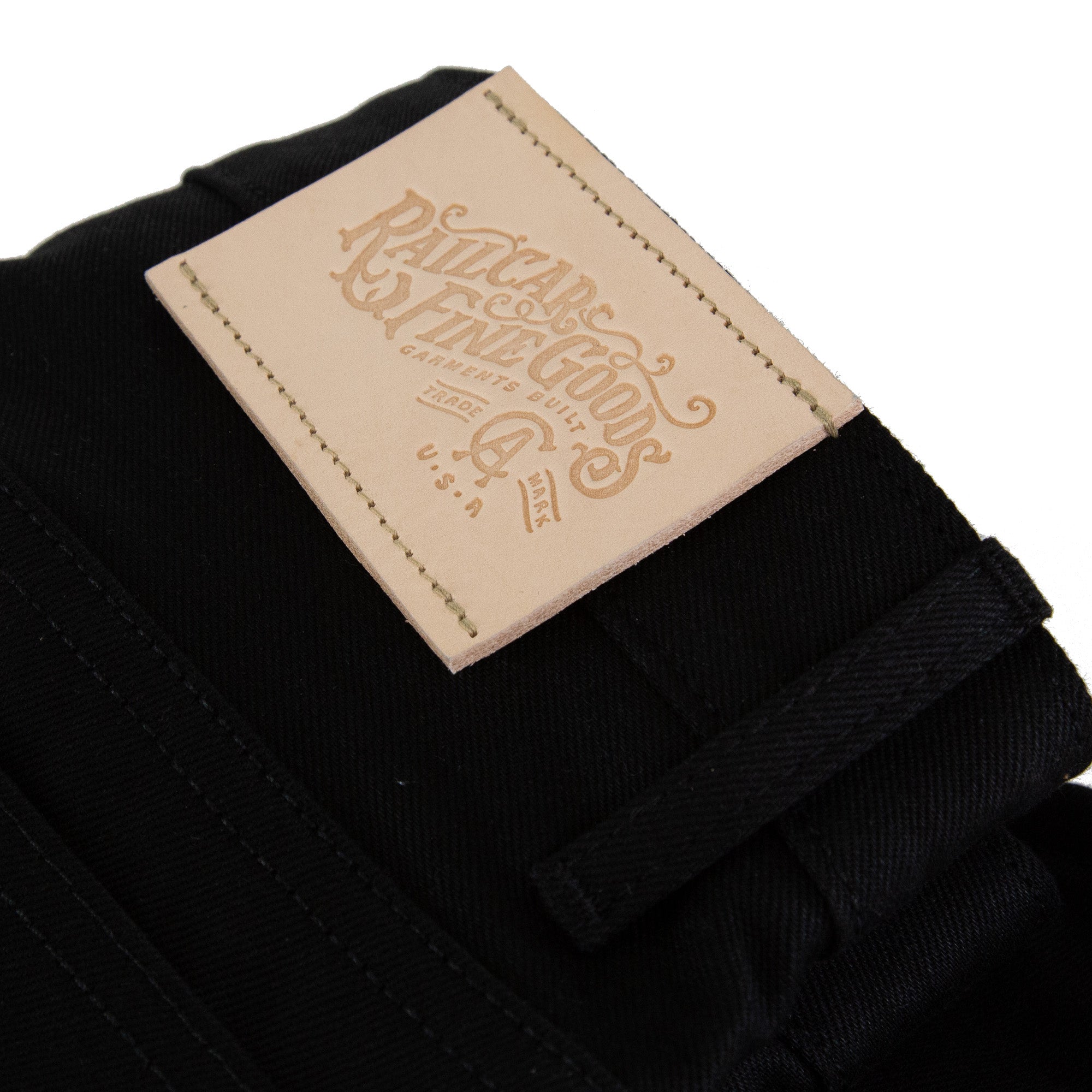 Close Uo of Leather of Spikes X111 Taper Leg 13.5 Oz Double Black Selvedge